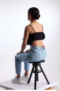 Jimena  1 black ruffled crop top blue embellished jeans…